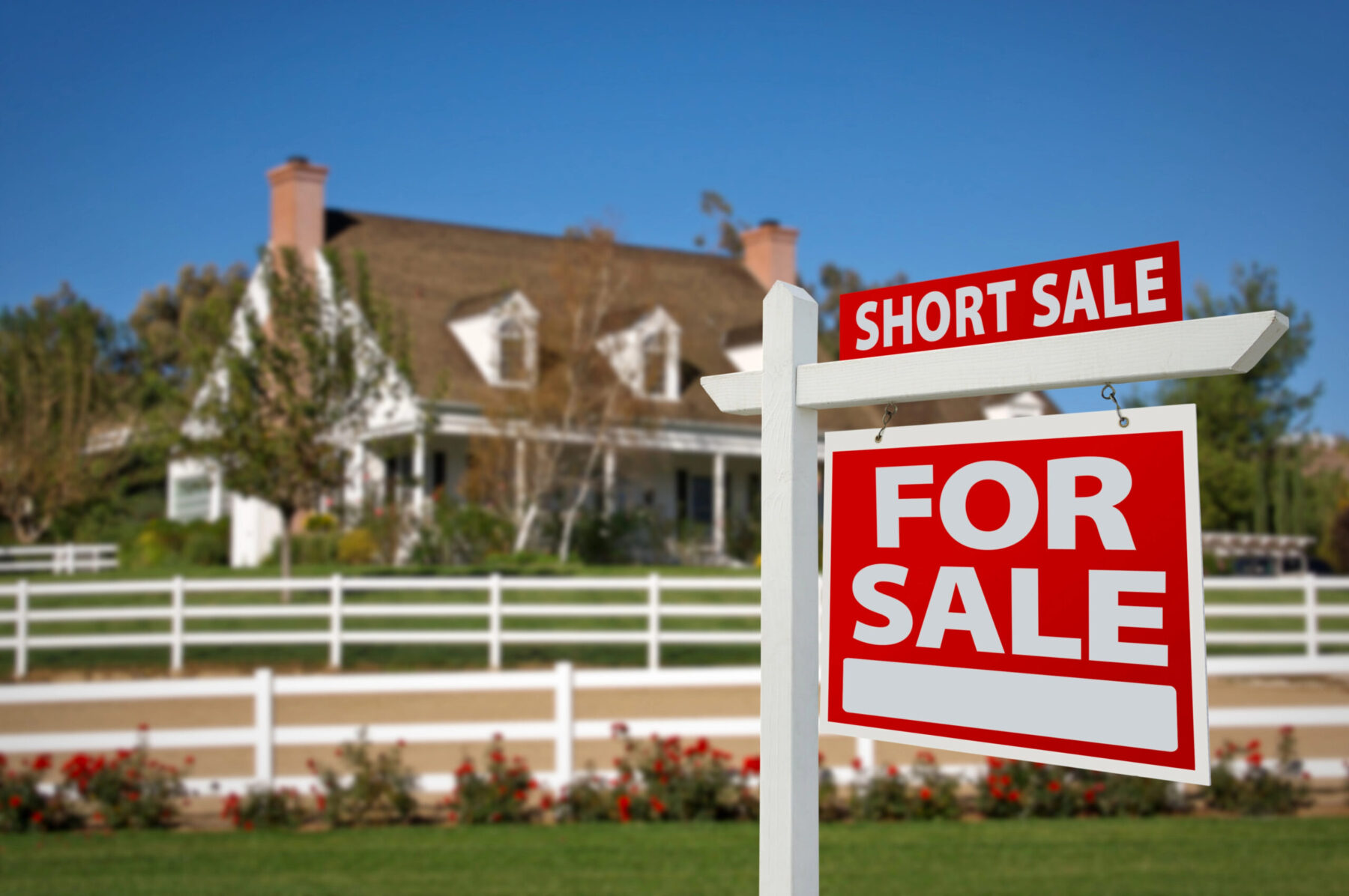 rural house with for sale sign in front