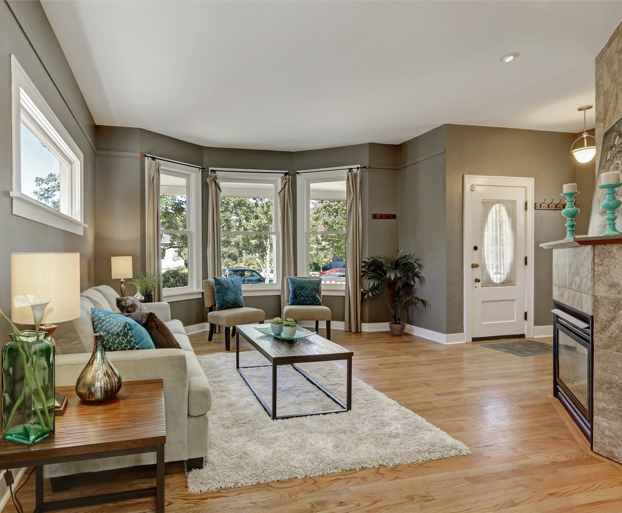 Open floor plan family room with fireplace and hardwood floor. Northwest, USA